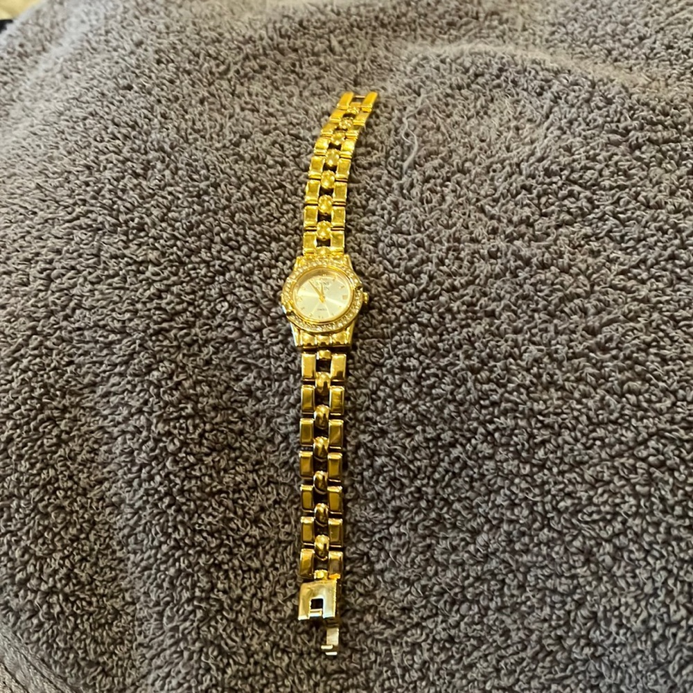 Anne Klein watch with interchangeable top rings and reversible band.